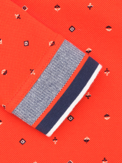 Polo garçon orange avec micro-motif montagne avec reflet