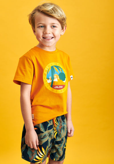 Boy's orange T-shirt with motif on the front