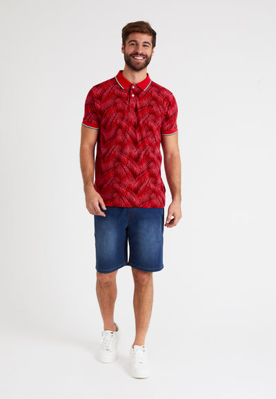 Men's short-sleeved orange piqué cotton polo shirt, palm leaf print